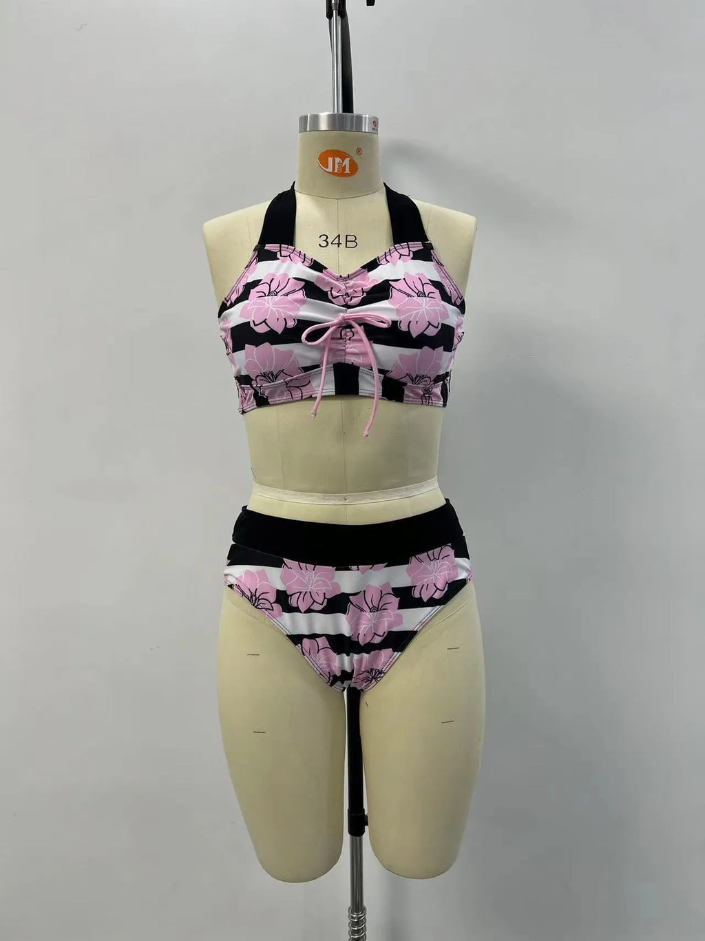 Black women's bikini with printed belly coverage and slimming split leg design.
