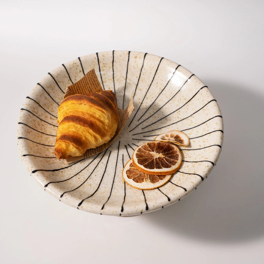 Black and white striped retro synthetic resin fruit plate ornament.