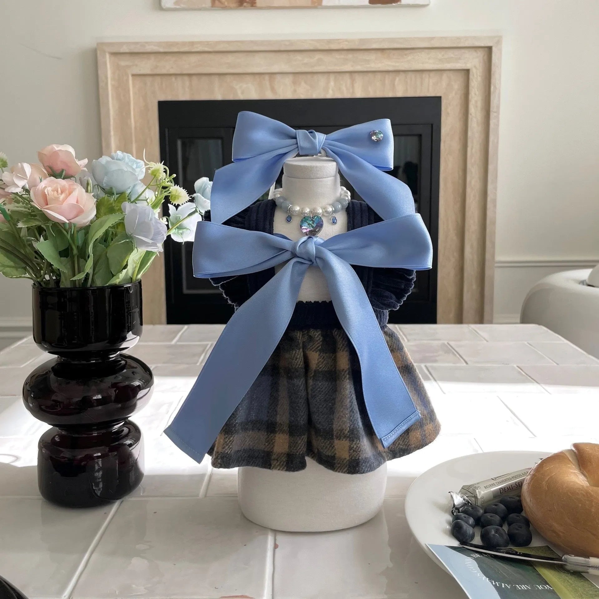 Blue princess-style dog hair band with adjustable bow on canine model