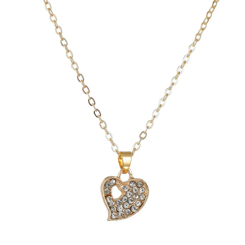 Gold tone love symbol jewellery set with earrings, pendant necklace and bracelet on 21-50cm adjustable chain