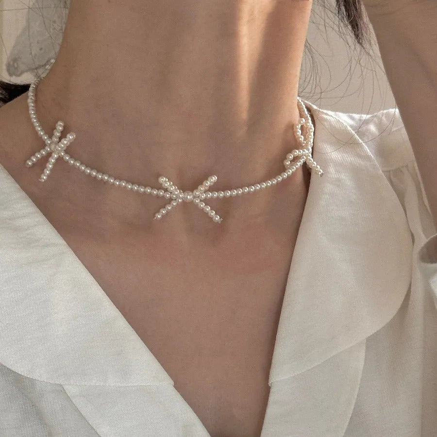 White sweet bow pearl necklace with geometric design on adjustable 31-40cm clavicle chain