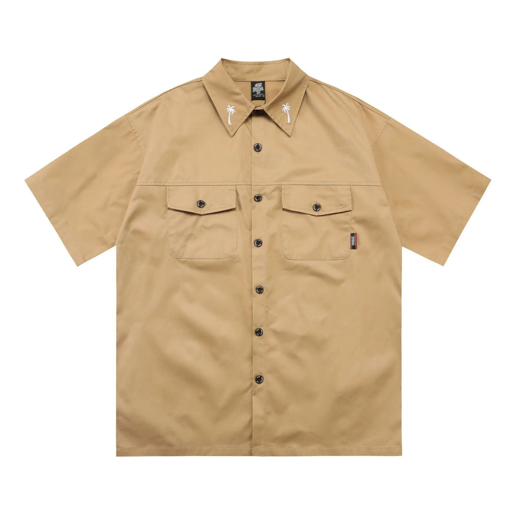 Men's black loose-fit cotton blend shirt with chest pocket and embroidered design on half sleeve.