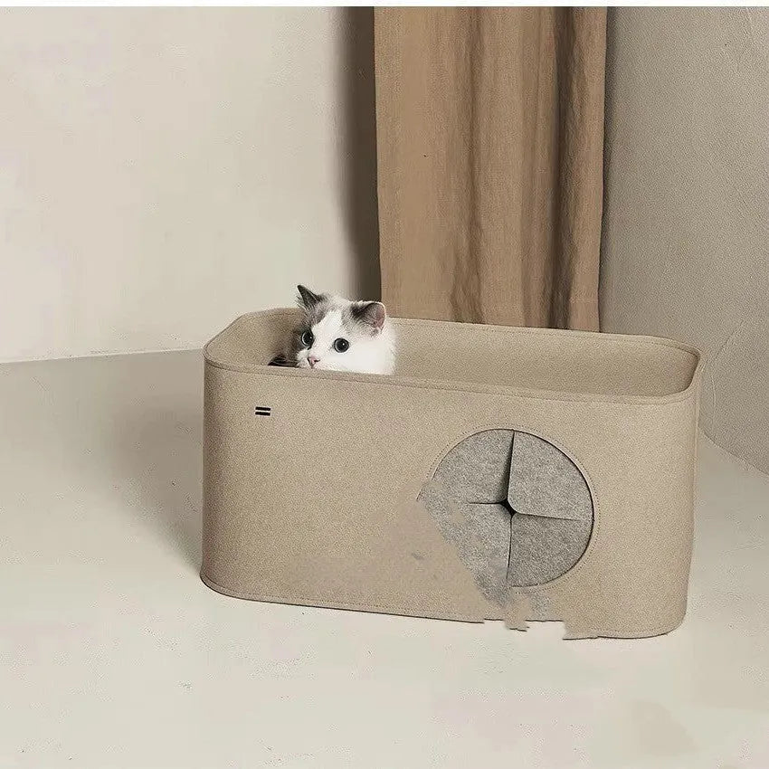 A grey foldable felt cat nest bed shown open and flat for storage.