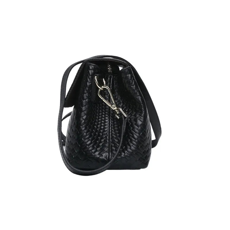 Black genuine leather woven crossbody bag with embossed finish, soft carry handle, and single shoulder strap.