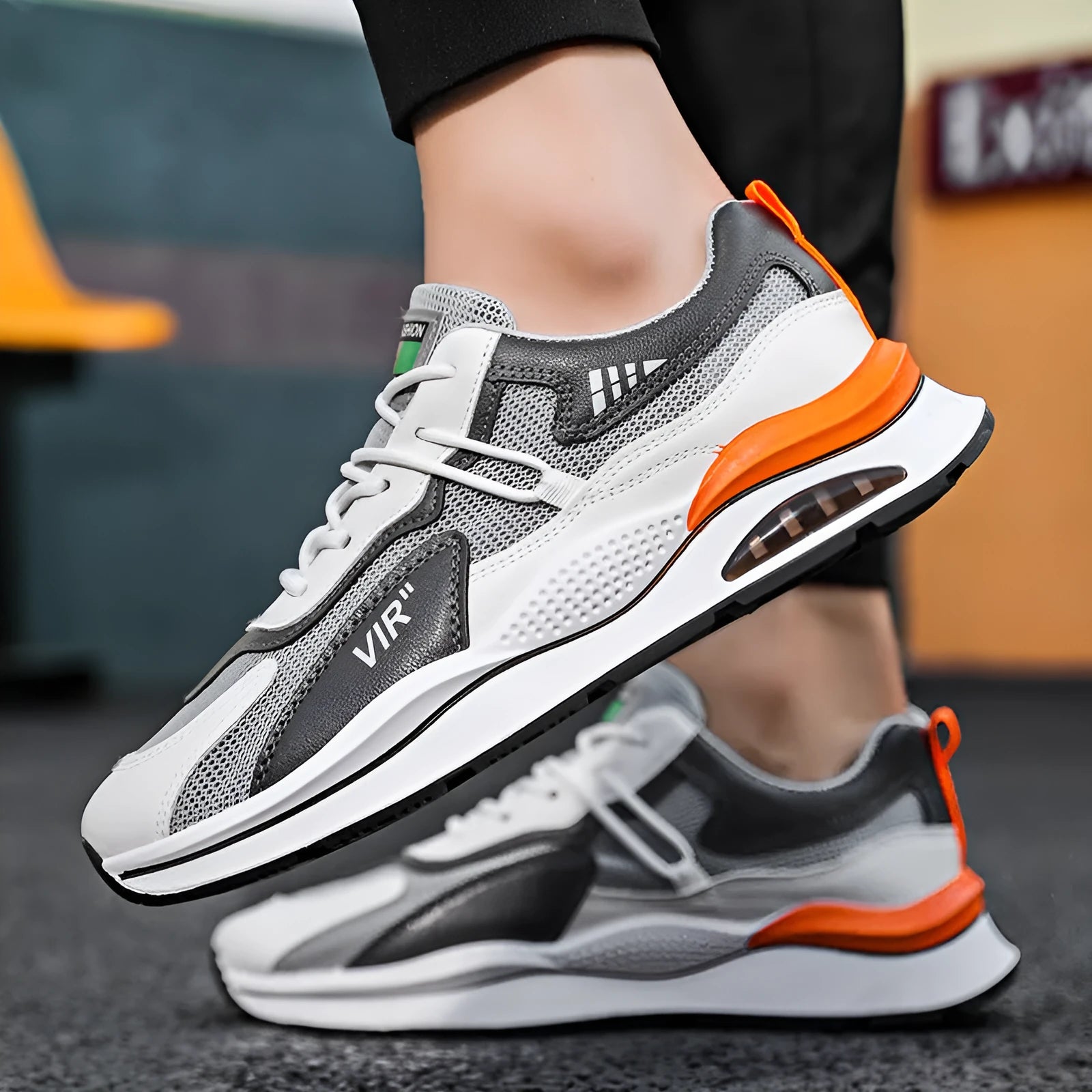Men's gray mesh running shoes with round toe and middle top height on white background