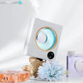 Small white wall-mounted automatic aromatherapy machine for essential oil diffusion.