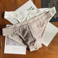 Men's solid colour cotton triangle briefs with a mid waist design on a white background.