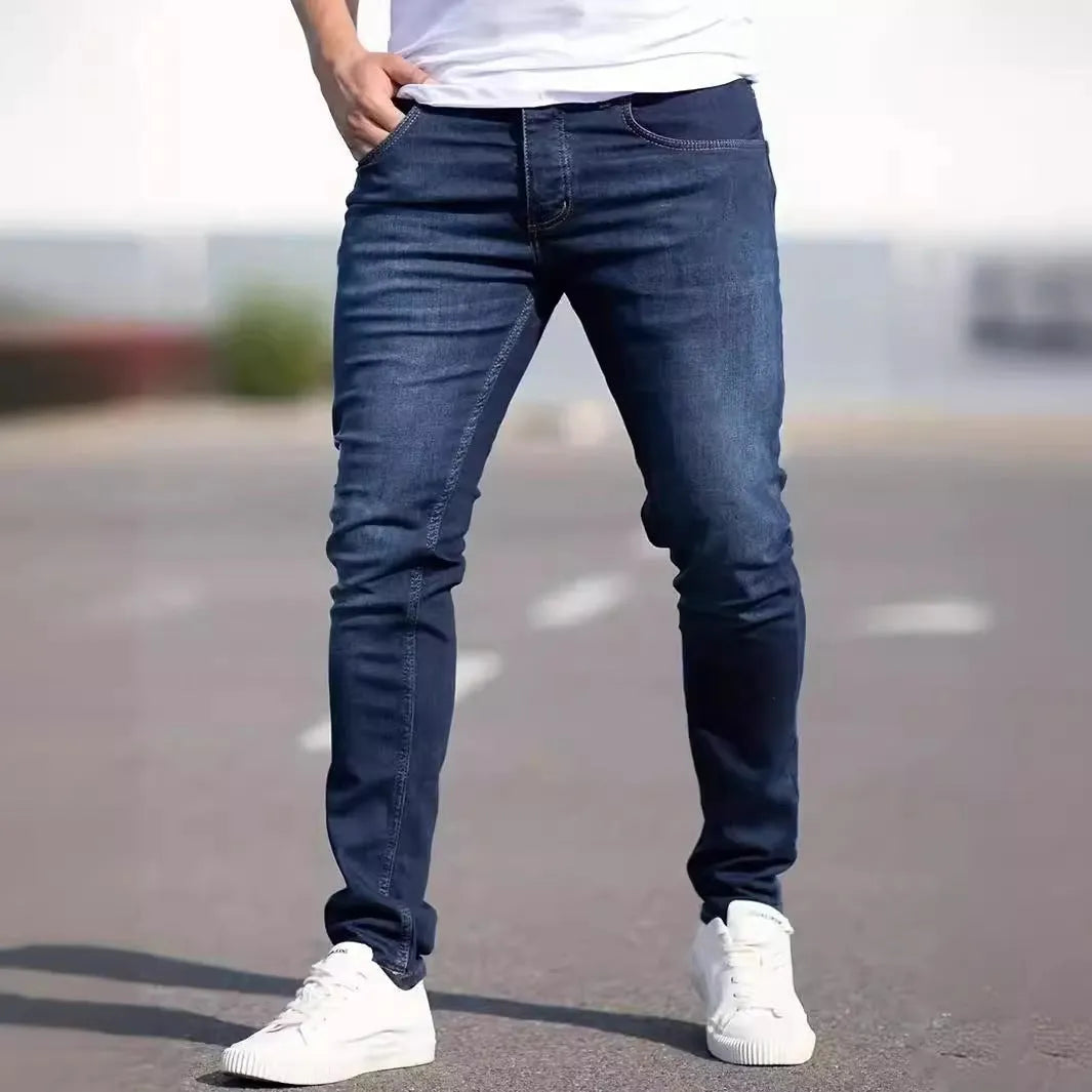 Men's slim-fit dark blue cotton jeans with mid waist and zipper fly