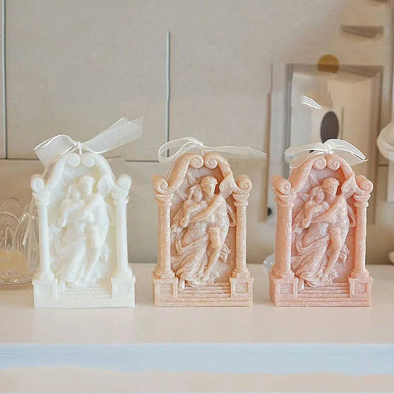 Flexible food grade silicone mold showing detailed Ancient Greek-style couple angel design for baking and crafts.