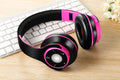 Foldable wireless Bluetooth headset in blue, red, or rose red with adjustable hinges.