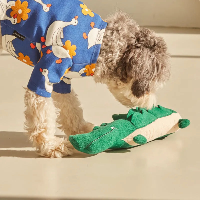 Green plush toy dog with interactive features, shown with scale indicating 35 cm length.