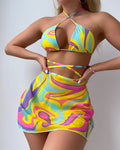 Yellow striped halter lace-up swimsuit for women with matching skirt and shorts.