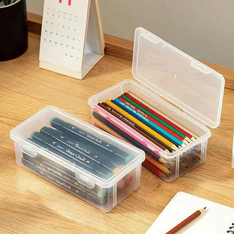 Transparent plastic pencil storage box showing interior capacity for organising drawing supplies