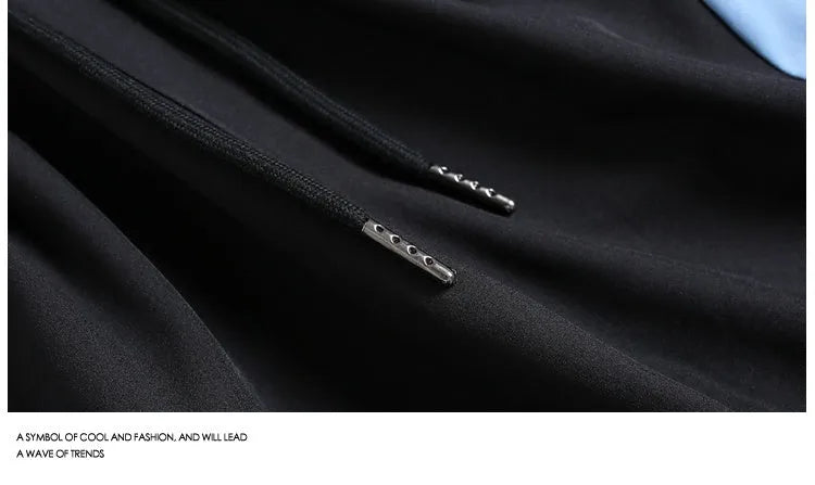 Men's black loose fit sports shorts with elastic waistband and contrast trim, shown on a hanger.