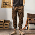 Men's khaki cotton harem pants with tapered ankle band and zip placket front view