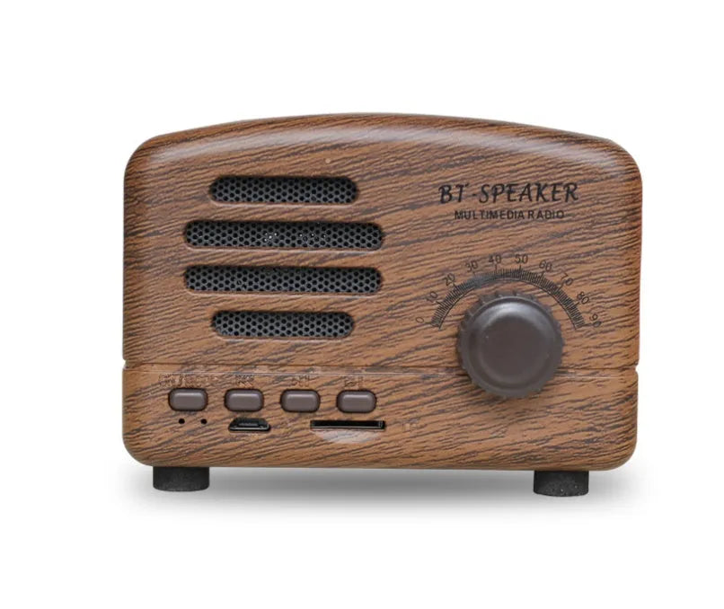 Compact vintage style Bluetooth speaker in wood grain finish on a wooden table