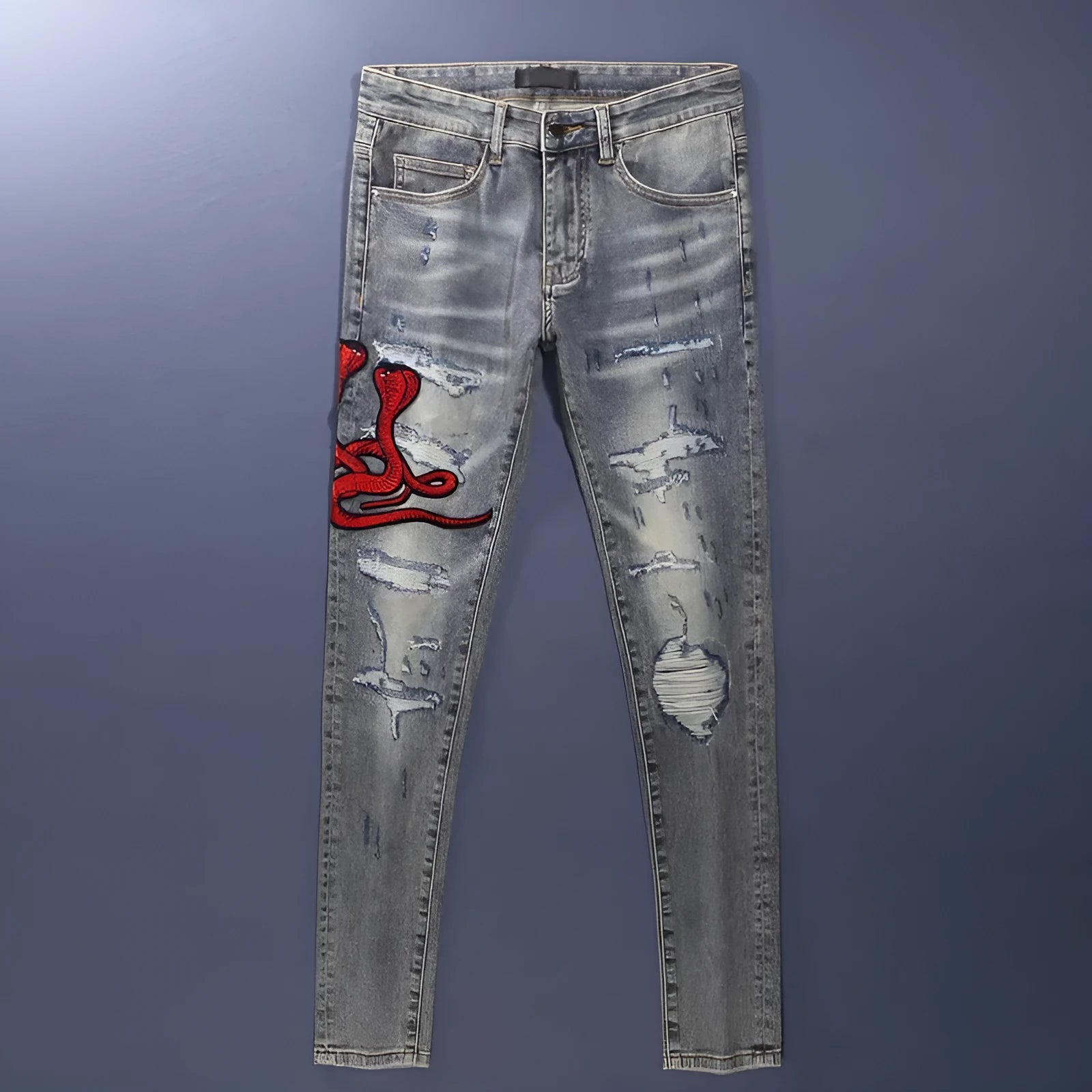 Men's washed-out slim fit jeans with patch detailing and embroidered branding on micro-elastic cotton