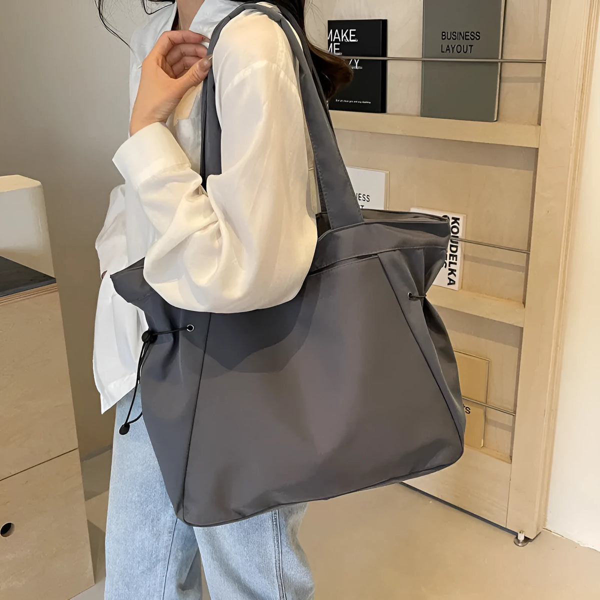 Soft Oxford cloth folding tote bag shown in a choice of five colours on a plain background.