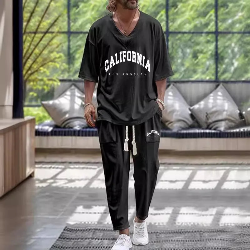 Man wearing a thin polyester V-neck trousers suit with cropped sleeves, available in multiple colours and sizes up to 6XL.