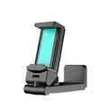 Black foldable rotating phone stand holding a mobile phone in landscape orientation on a desk.