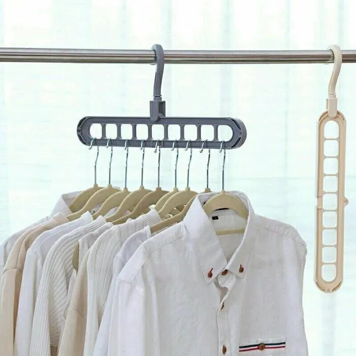 Plastic clothes hanger with rotating hook shown in pink, dimensions 33 cm long by 17 cm high