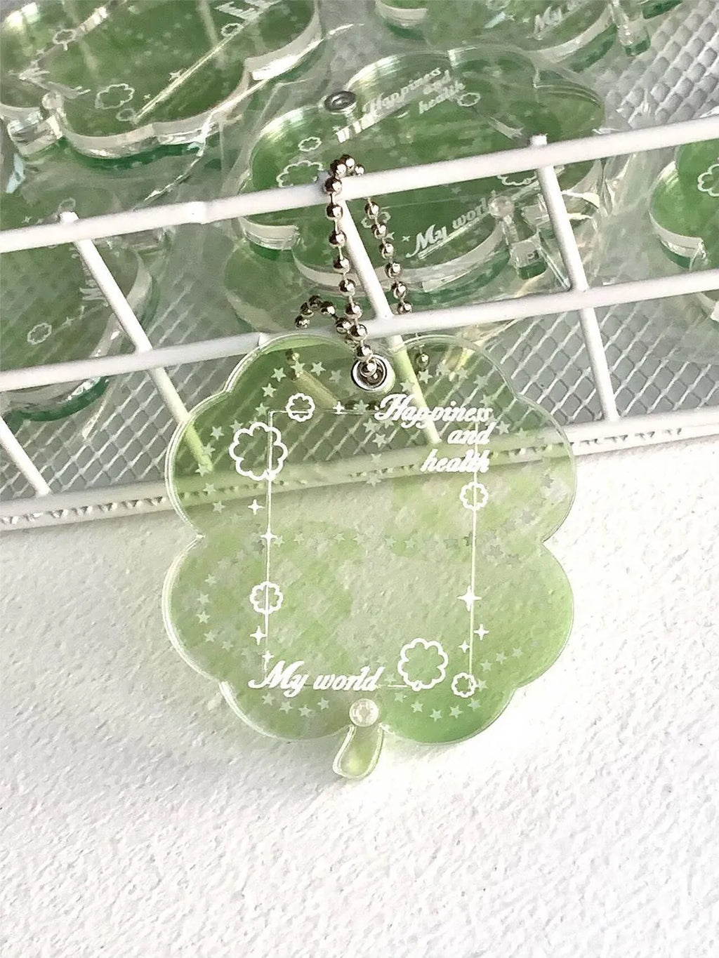 Acrylic four-leaf clover phone pendant in three colour variations