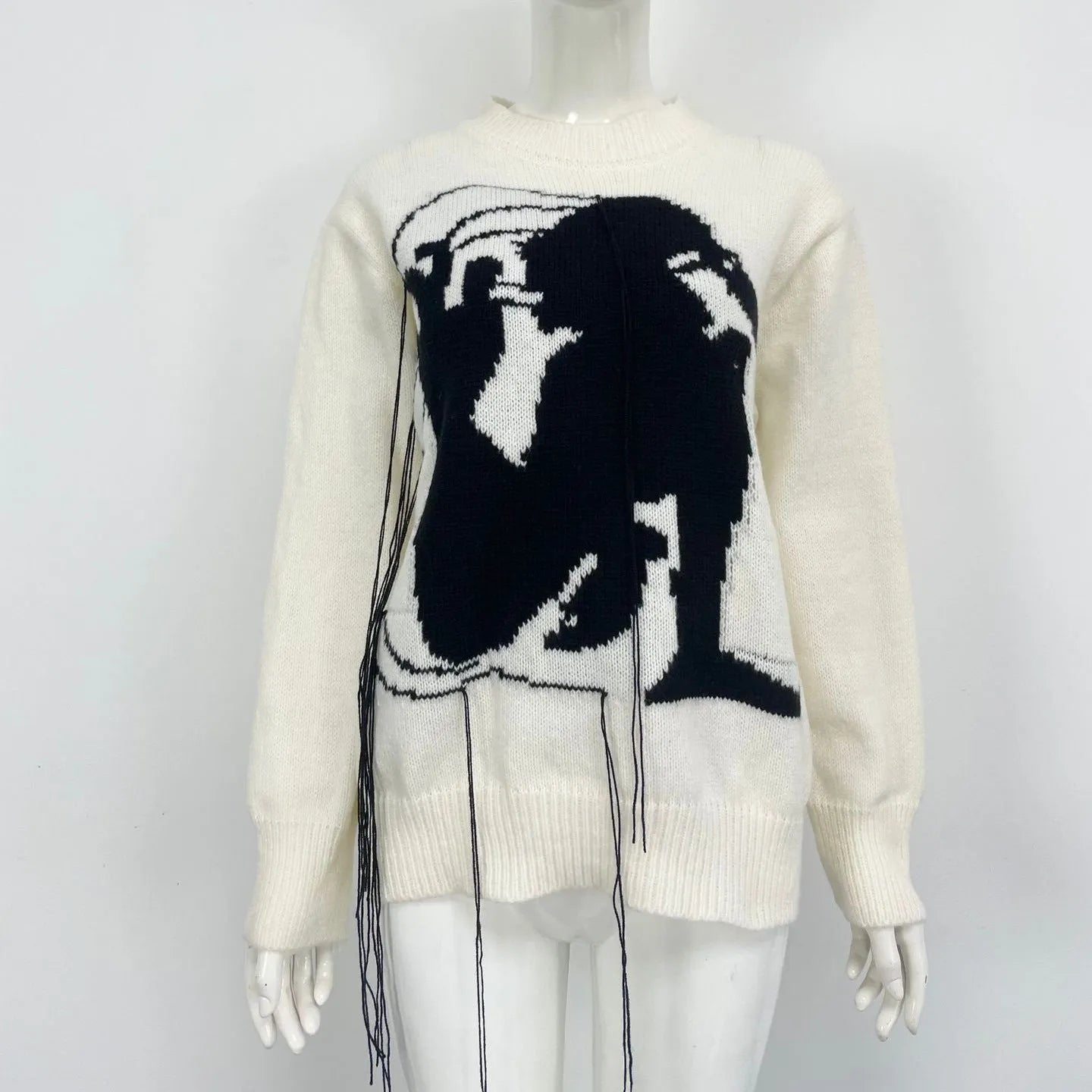 Women's grey alpaca wool sweater with tassel detailing and abstract pattern