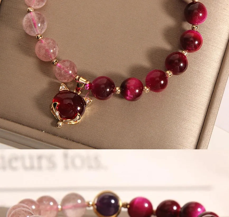 Women's strawberry crystal bracelet with elastic rope showing uniform 18cm size and simple design