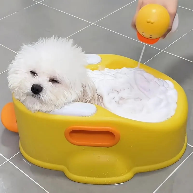 Blue PVC duck-shaped pet bathtub for washing dogs and cats on a plain background