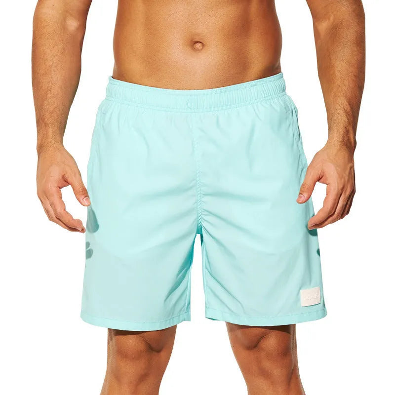 Men's quick-drying nylon sports shorts in blue with straight leg openings