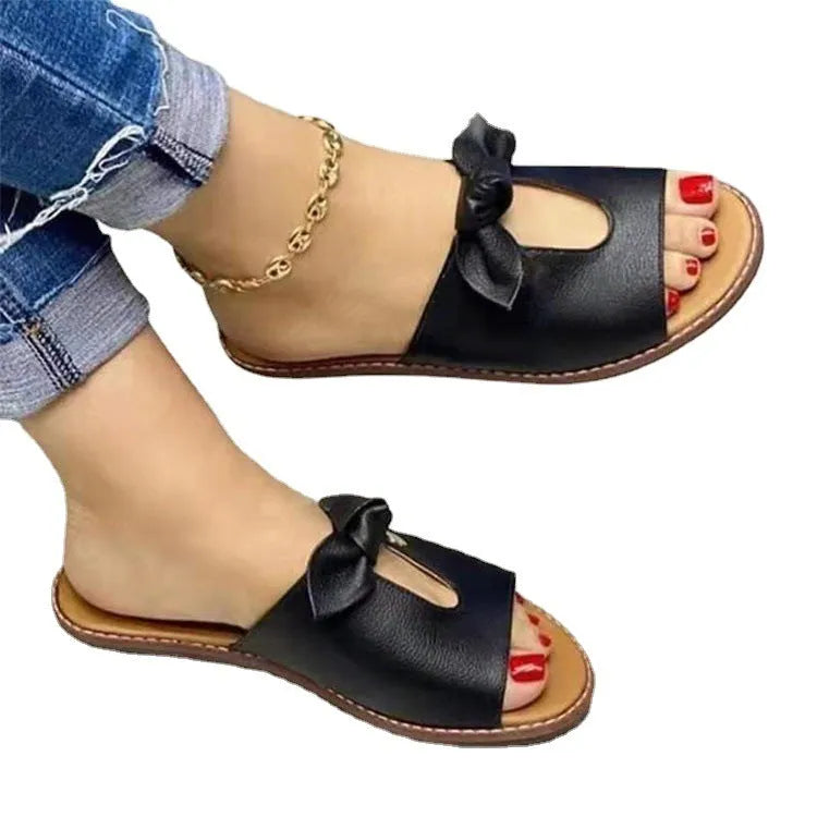 Ladies black fish mouth sandals with a bow detail on the strap.
