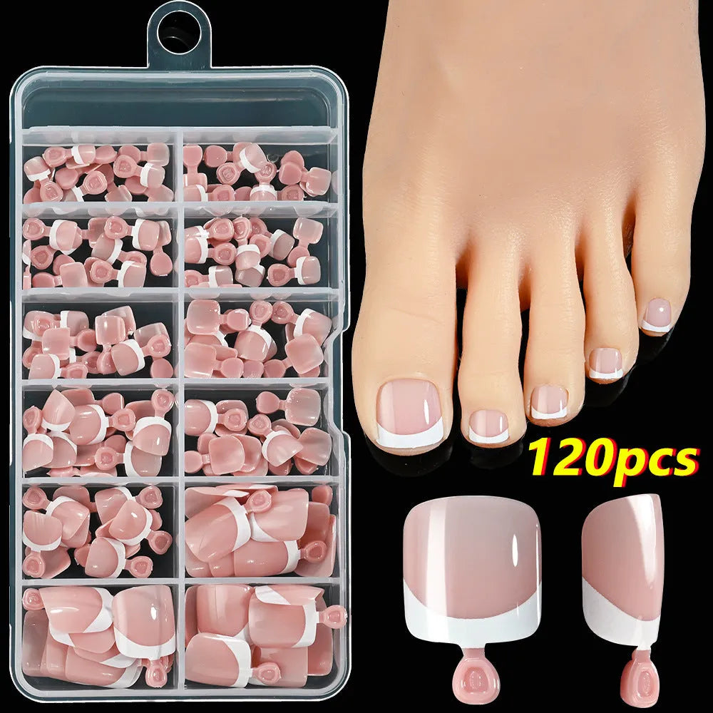 120 piece box of square short French style artificial toe nails with white tips on nude base.