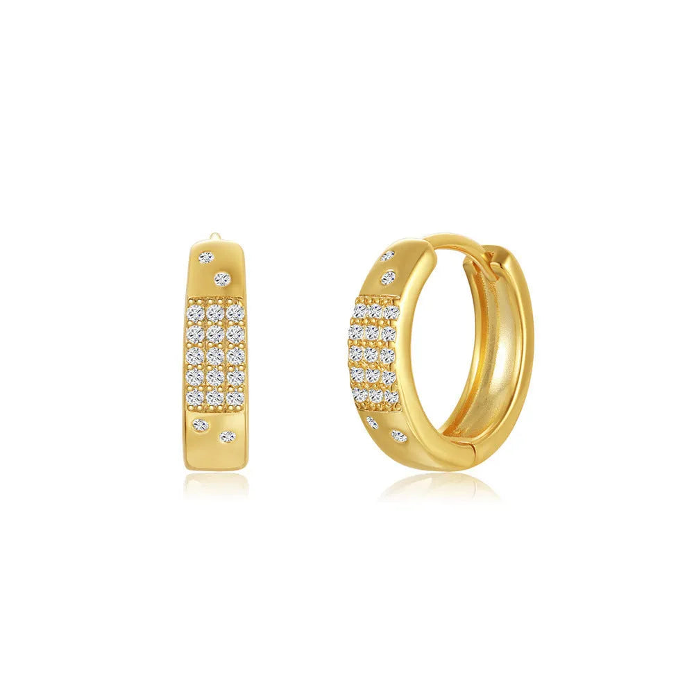 A pair of simple round geometric brass earclip earrings with a gold electroplated finish.