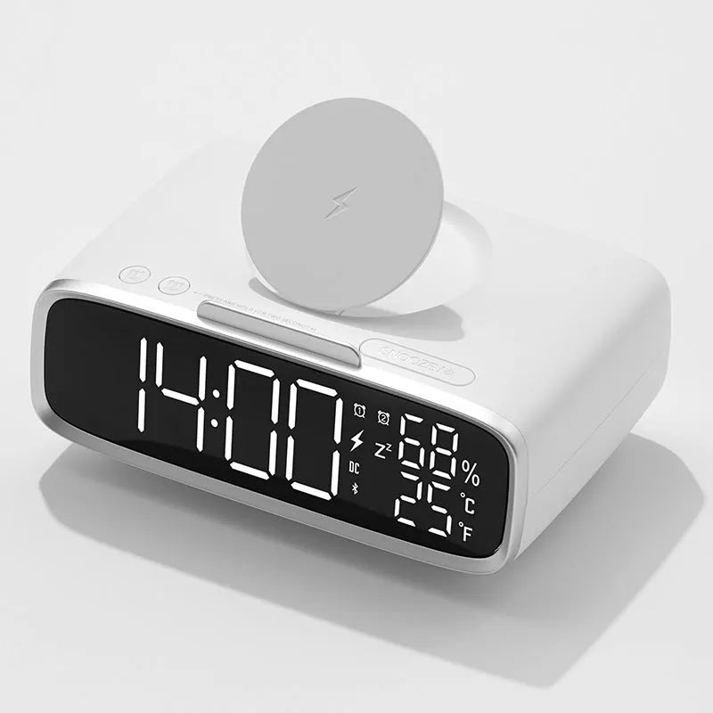 White compact Bluetooth speaker with integrated wireless charging pad and night light on a table
