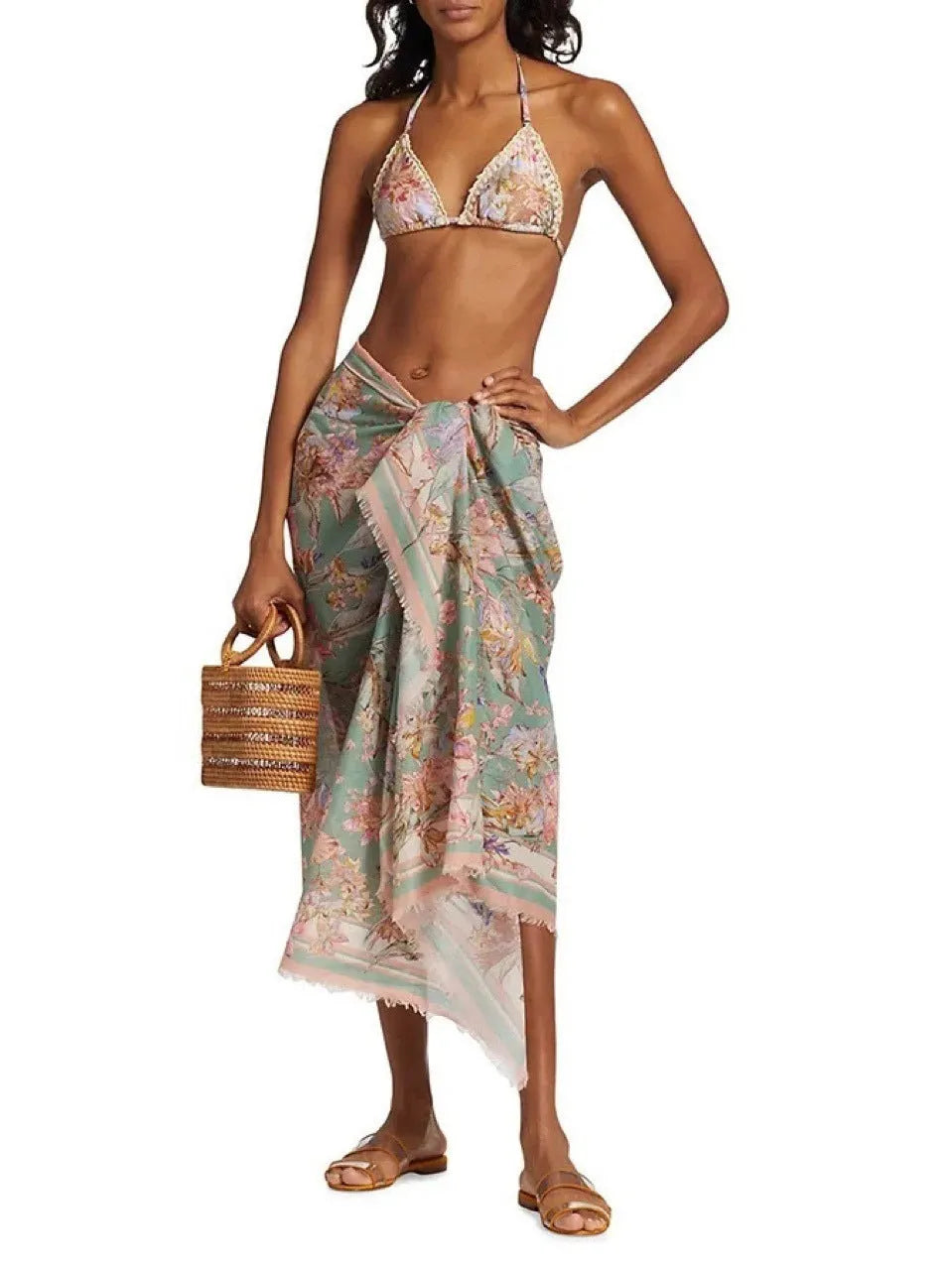 Women's floral bikini swimsuit set with top, briefs, and skirt in creamy-white beige colour