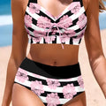 Black women's bikini with printed belly coverage and slimming split leg design.