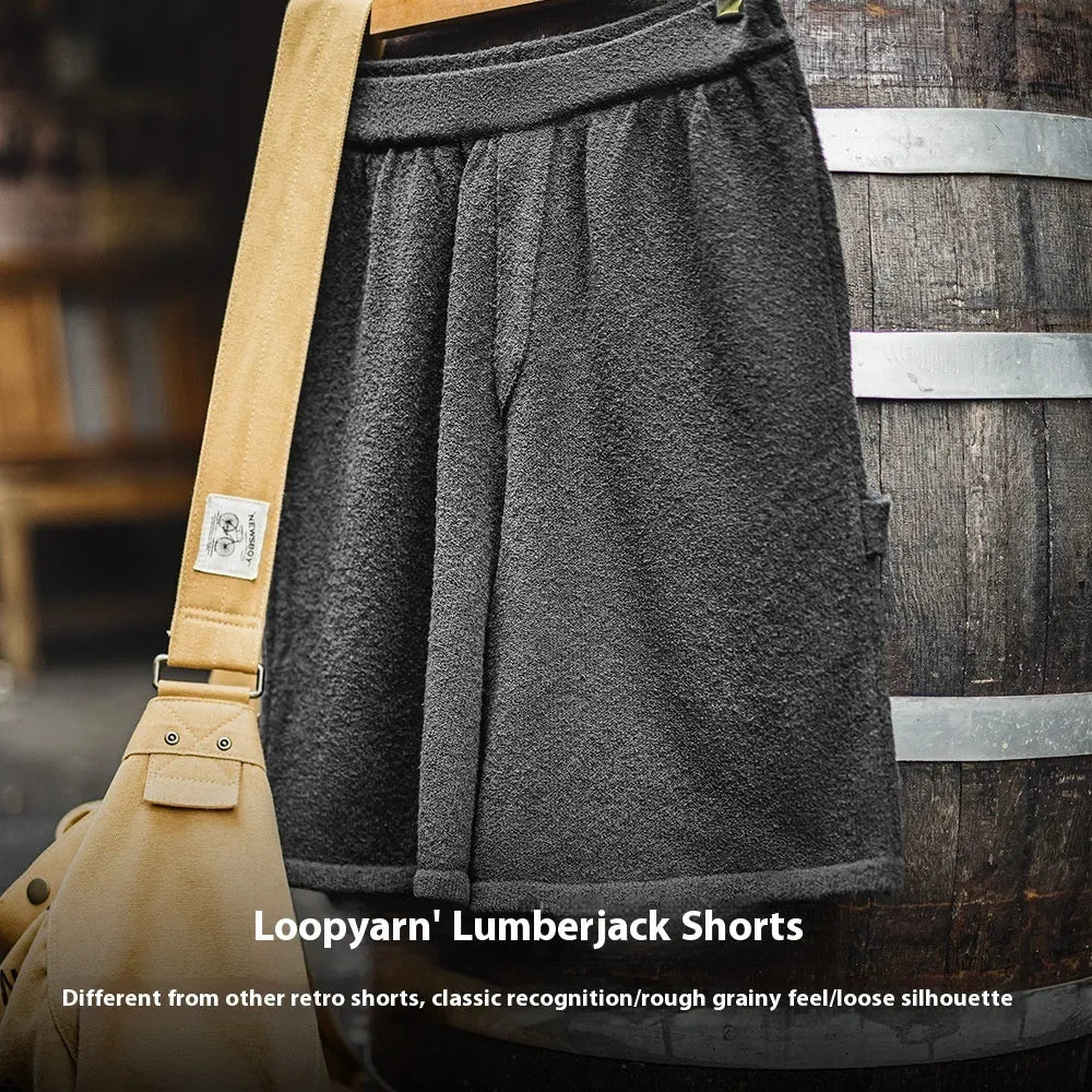Cement grey men's straight-leg athletic shorts with elastic waistband on a plain background.