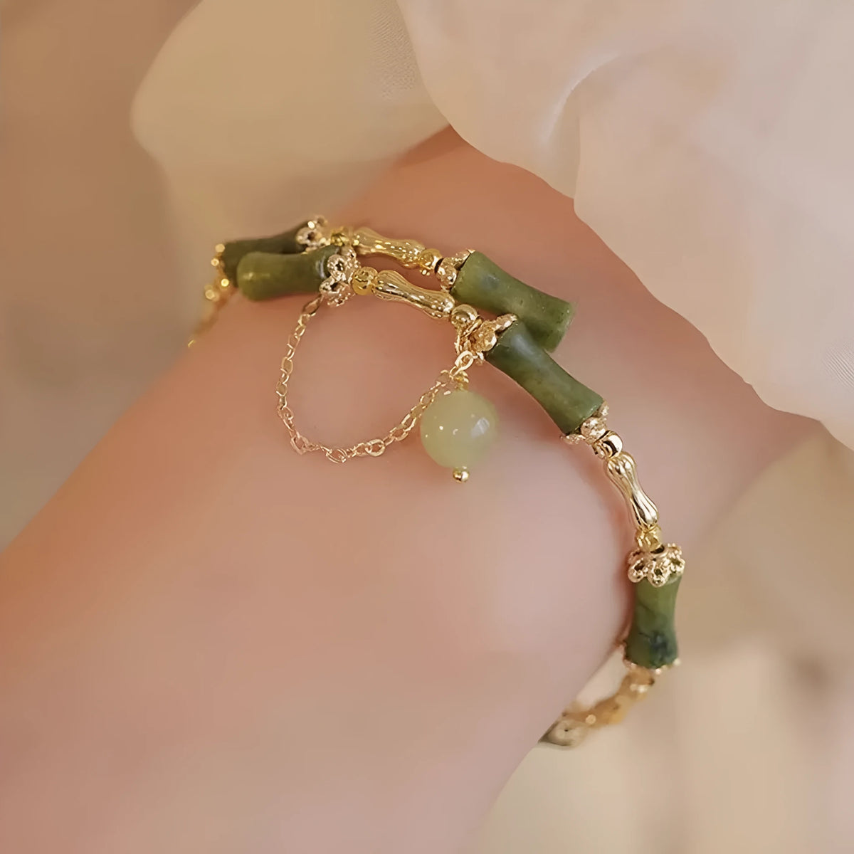 Personalised plum wine coloured glaze bracelet with a central bamboo joint bead for women.