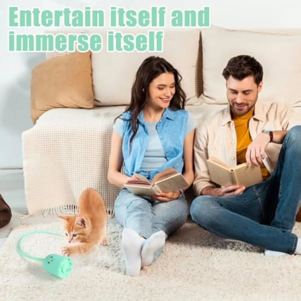 Green automatic cat wand toy with silicone tails swinging, placed on wooden floor