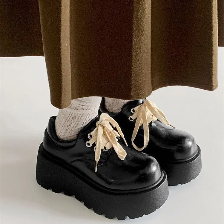 Black women's lace-up shoes with English muffin heels and round toe