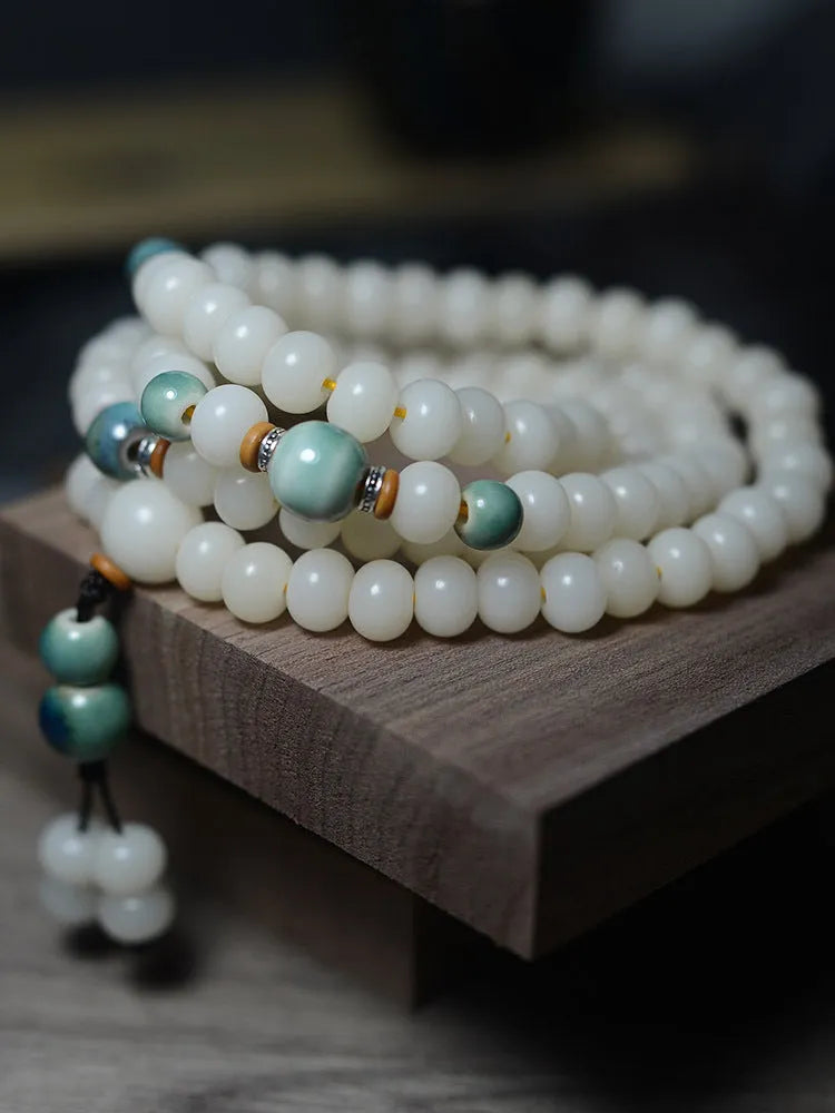 White Jade Bodhi Root bracelet with 108 flat round beads, shown in two size options.