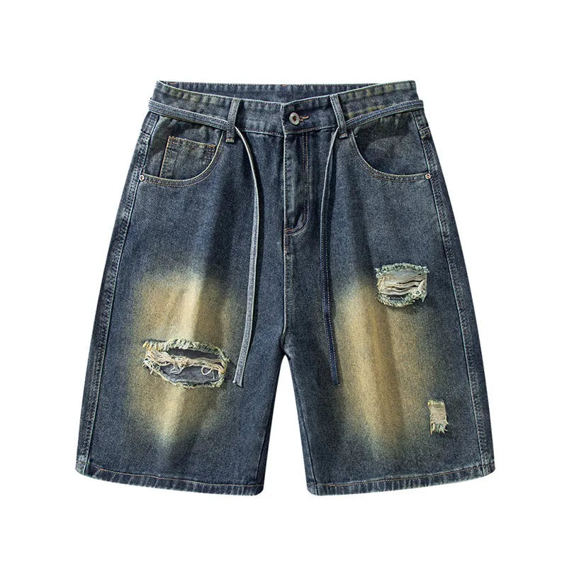 Man wearing retro blue loose-fit distressed denim jeans on a casual street.