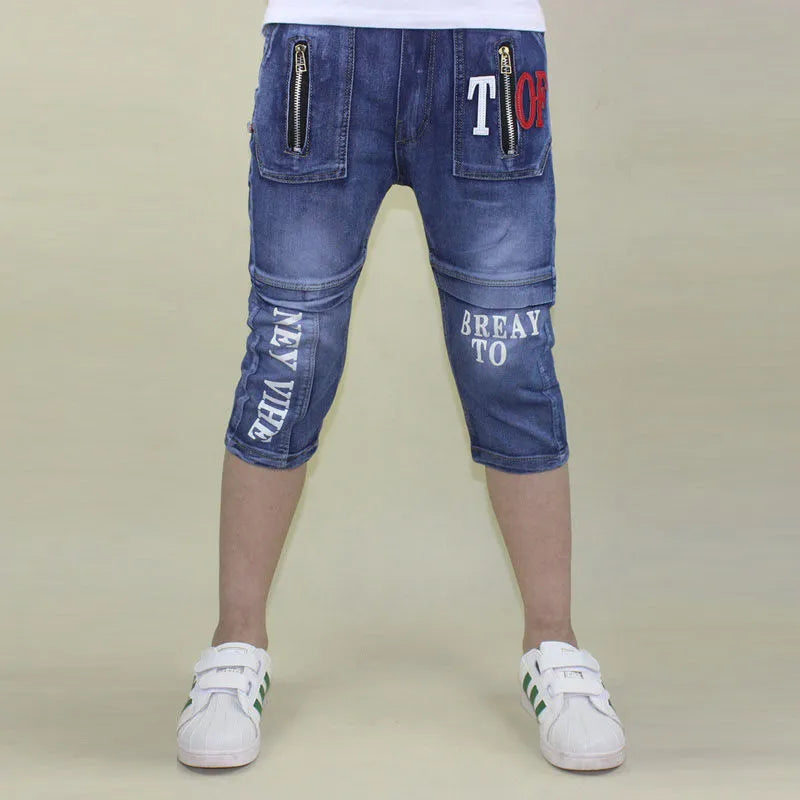 Boys loose stretch cropped jeans in blue cotton with high waist, sizes 105cm to 170cm
