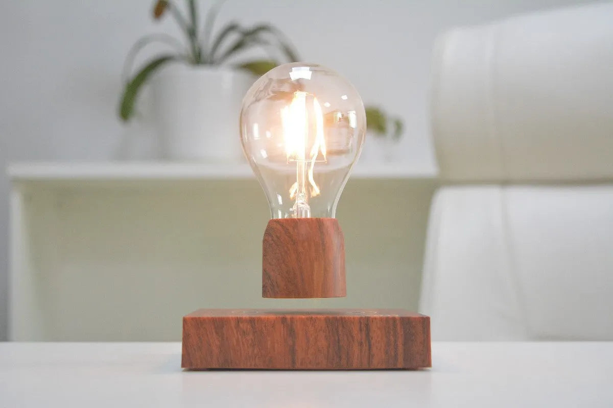 Magnetic levitation floating bulb lamp with glass bulb and imitation wood base
