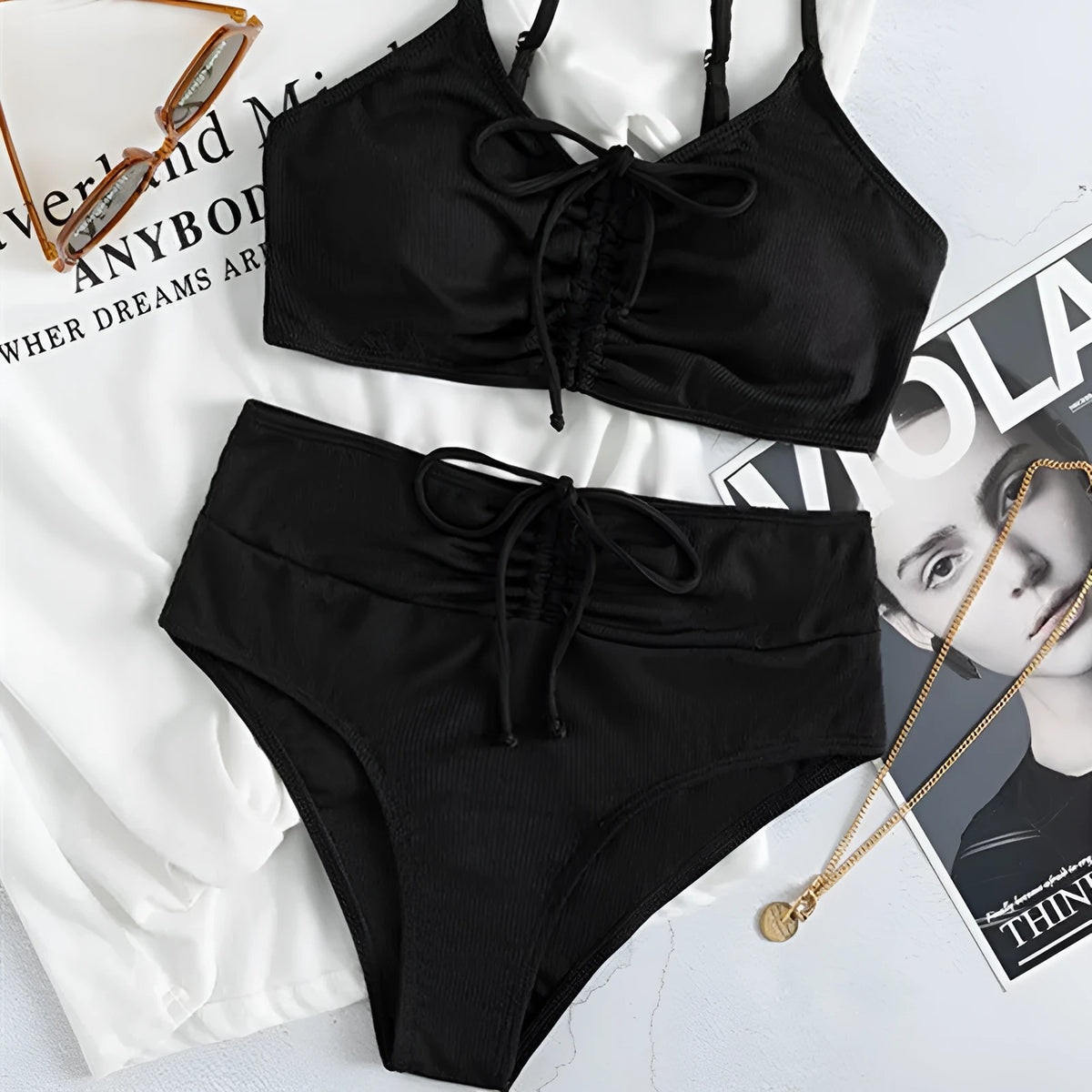 Black women's bikini swimsuit with sling split high waist design and matching shorts