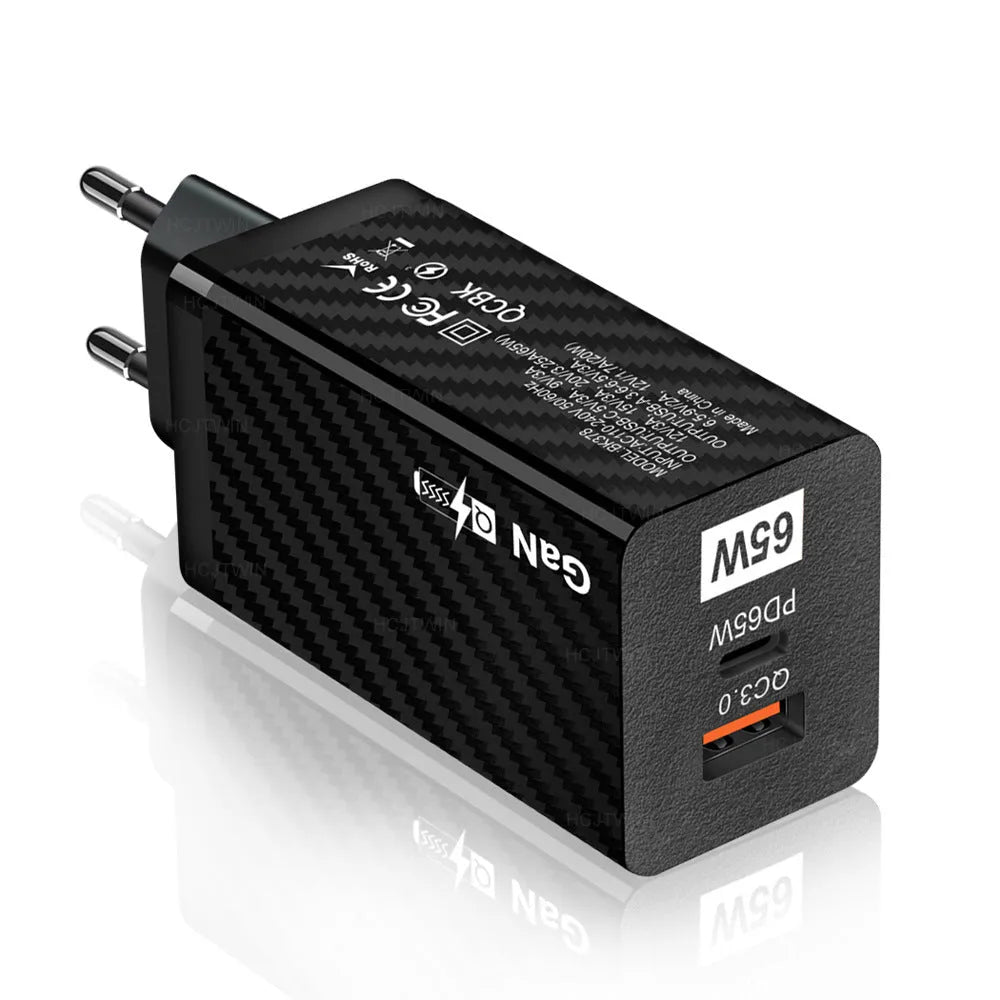 White GaN 65W universal laptop charger with USB PD port showing compact dimensions