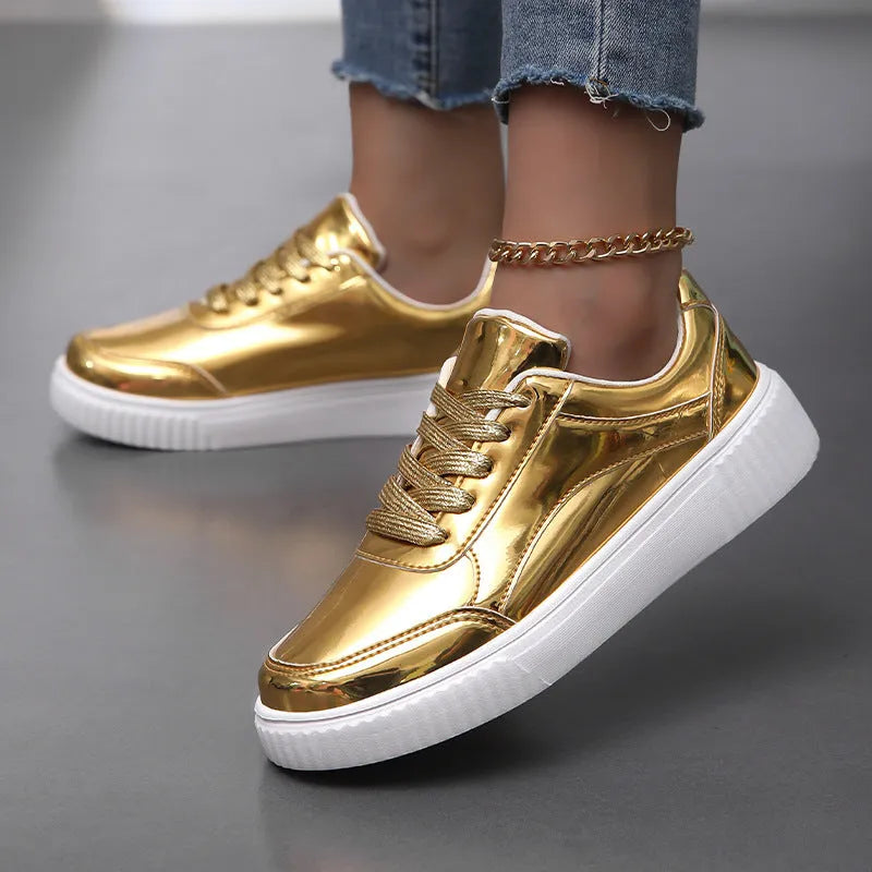 Rose gold sequin platform sneaker with thick sole and round toe on a white background.