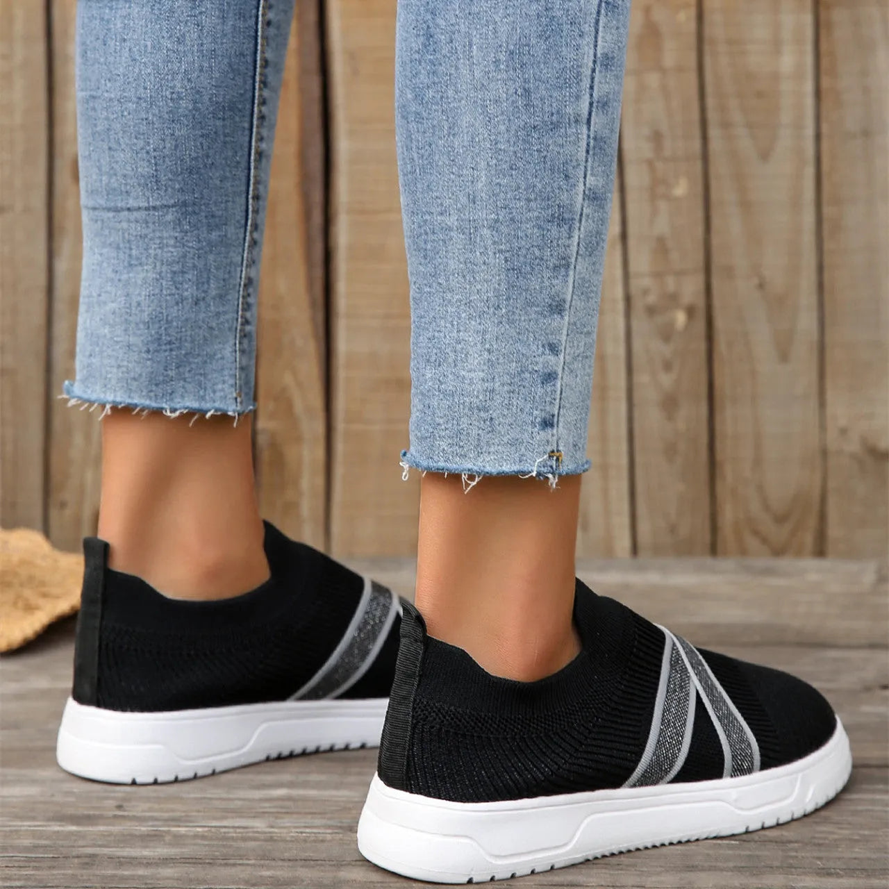 Black women's flyknit mesh casual shoes with flat rubber sole and tassel detail