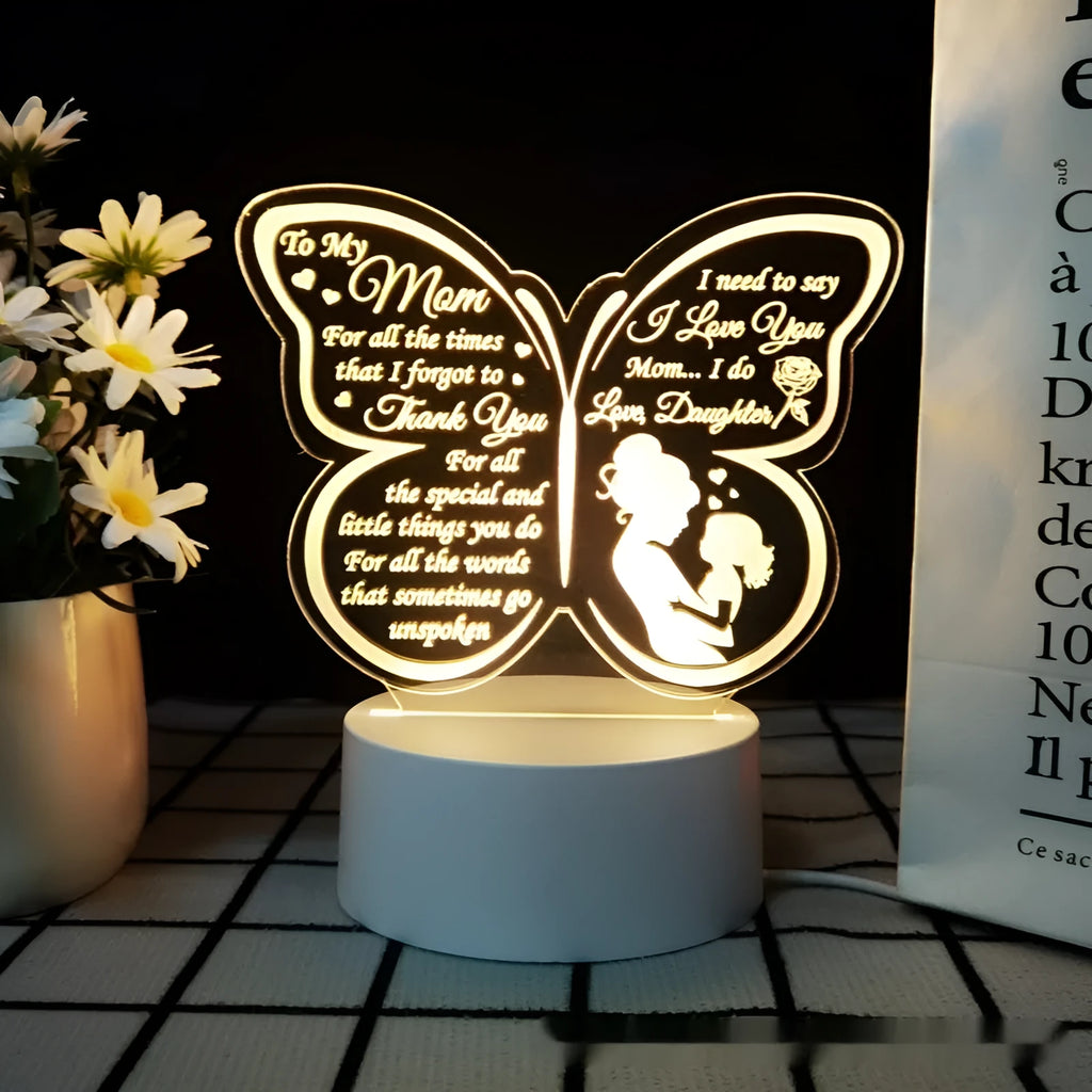 White heart-shaped table lamp with acrylic shade and touch switch on a wooden surface.
