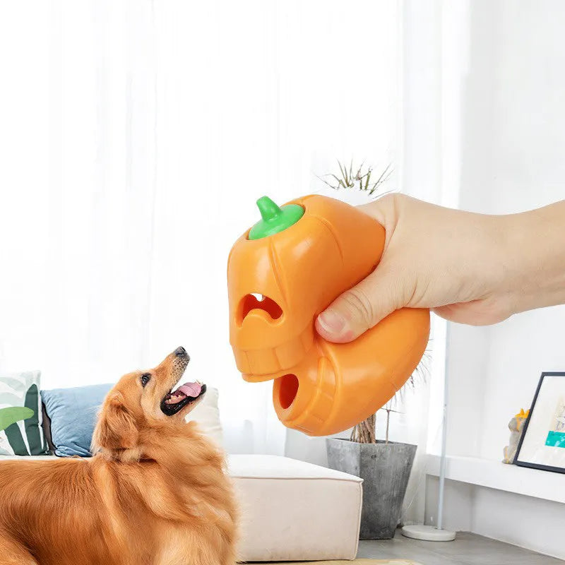 Orange Halloween pumpkin shaped interactive dog chew toy with treat dispensing funnel